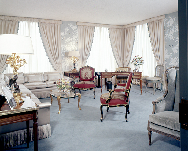 Empty living room with chairs and sofa