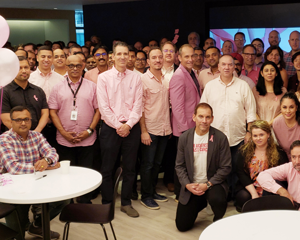 Group of people wearing pink for breast cancer awareness