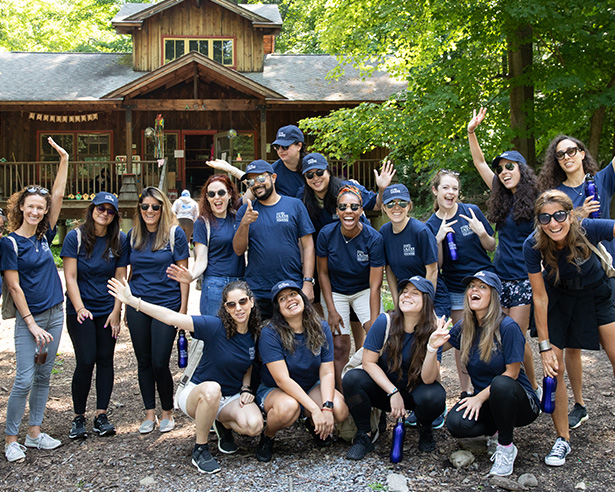 Group of people outside wearing navy blue shirts