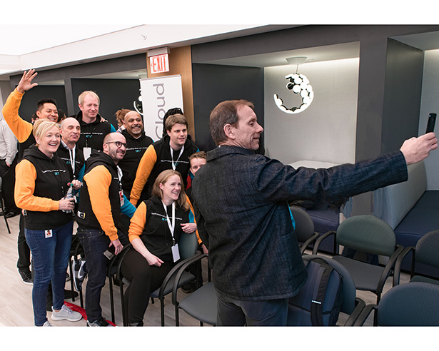 Michael W. Smith with employees