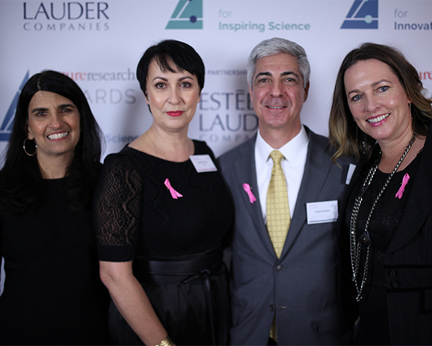 Four people posing for a photo