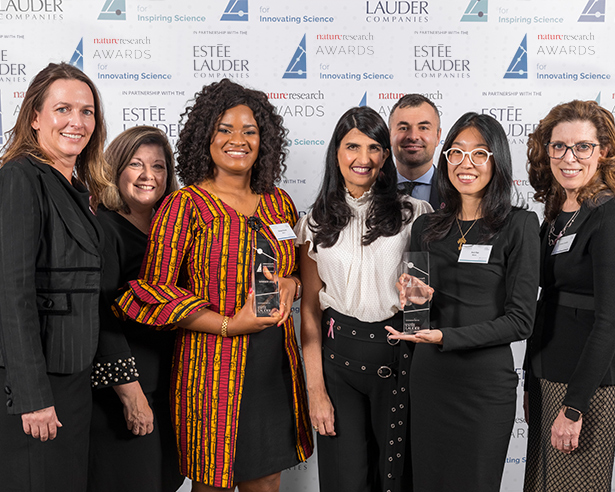 Group of people holding awards