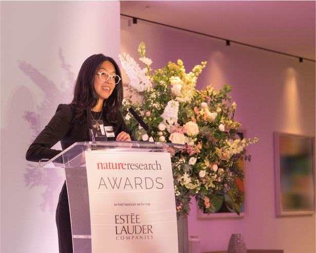 Woman speaking at a podium